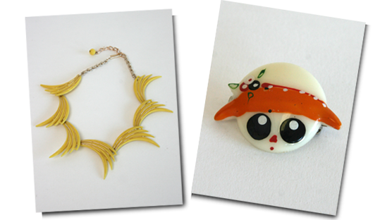 Stylised fan necklace and big eyed doll face brooch. Stylised fan necklace and big eyed doll face brooch.