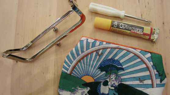 Glue + screw driver = final stage to making your very own snap frame purse
