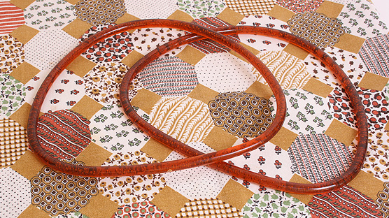 The raw materials: patchwork table cloth & glitter knitting handles.